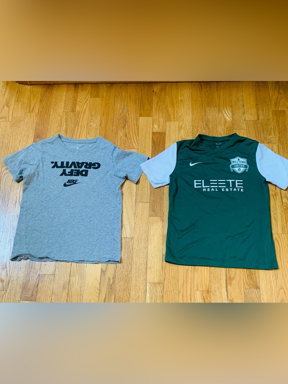 2 Nike Boys L Shirts : Defy Gravity' Nike tee and a green Milltown United jersey